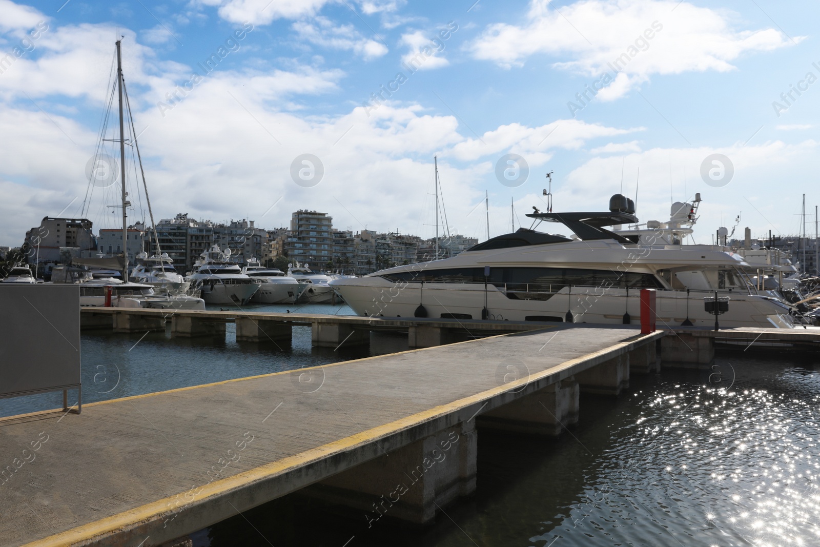 Photo of Picturesque view of port with modern boats on sunny day