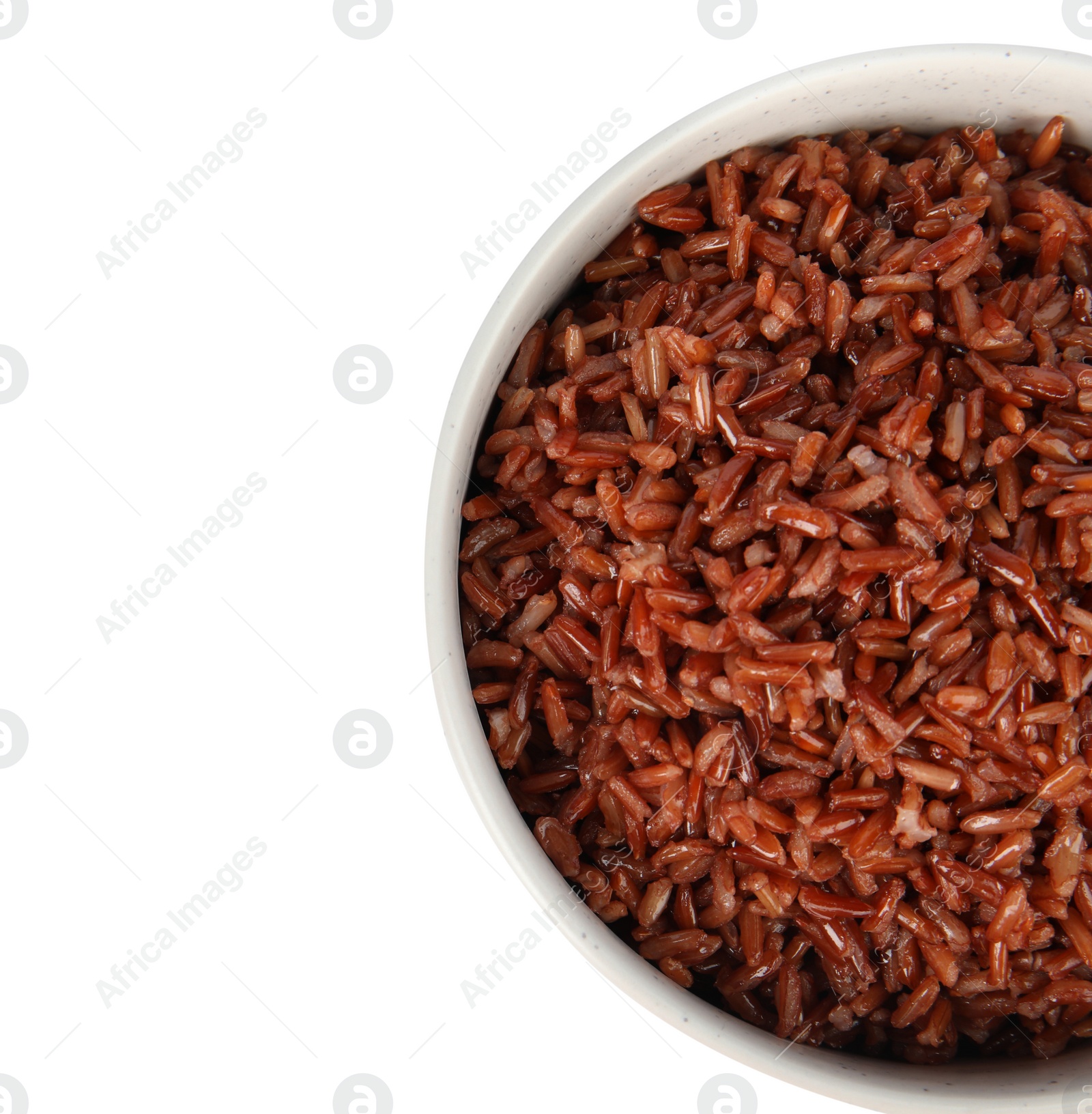 Photo of Bowl with delicious cooked brown rice on white background, top view