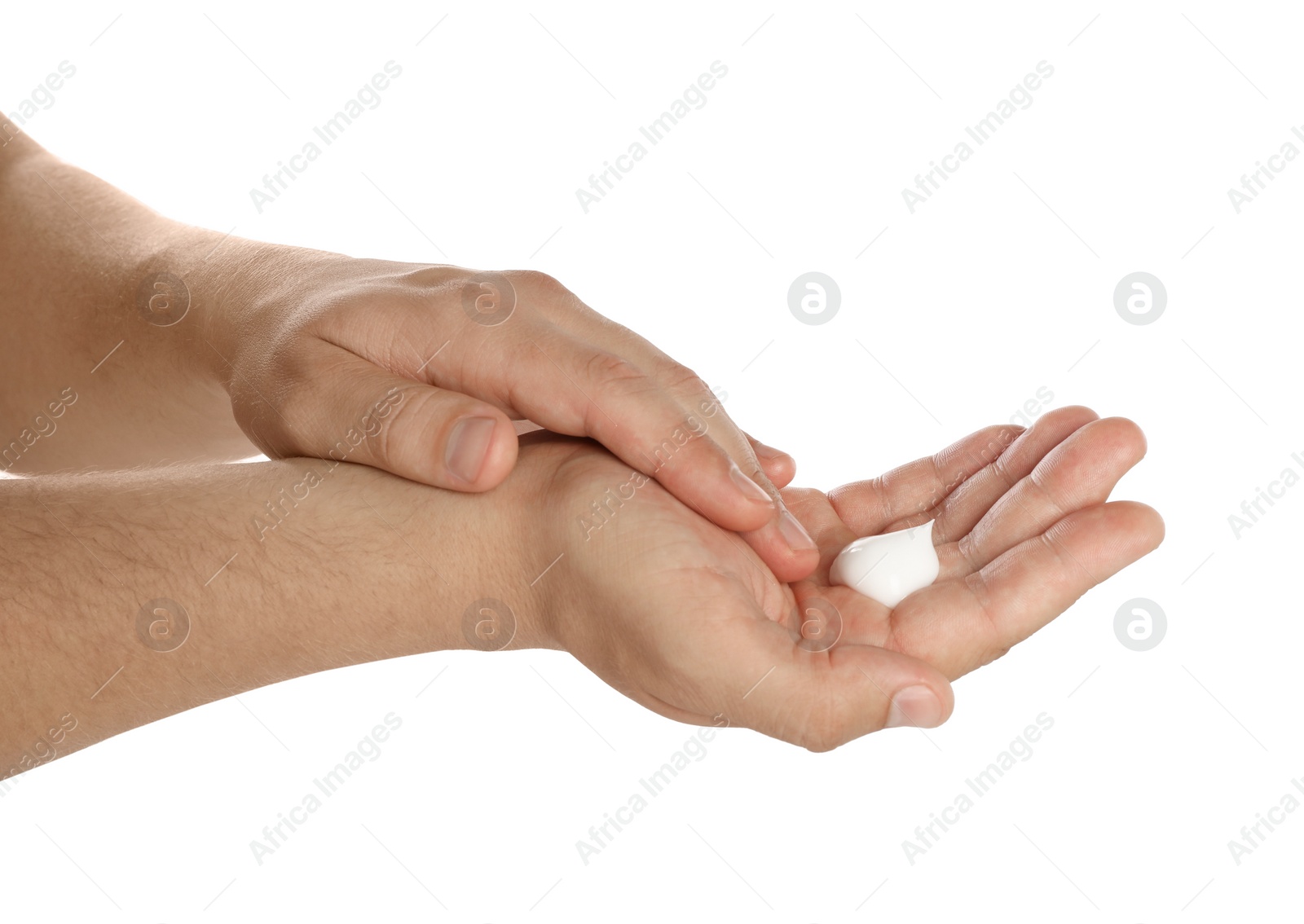 Photo of Man applying cream on hands against white background, closeup