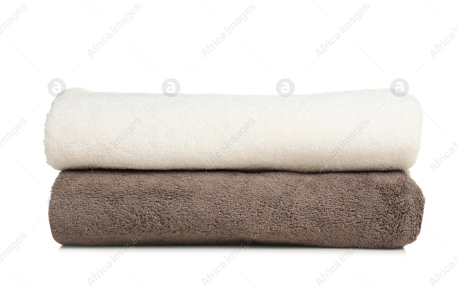 Photo of Folded soft terry towels on white background