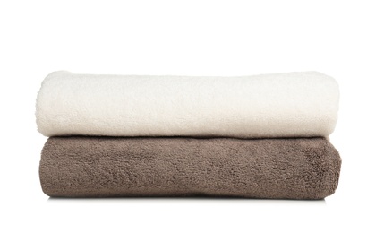 Folded soft terry towels on white background