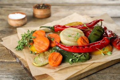 Photo of Delicious grilled vegetables on wooden table, closeup