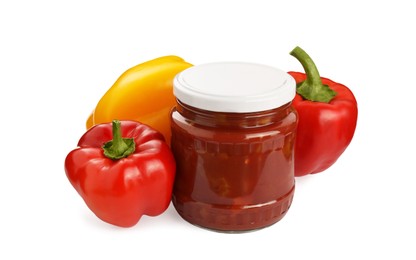 Photo of Glass jar of delicious canned lecho and fresh bell peppers on white background