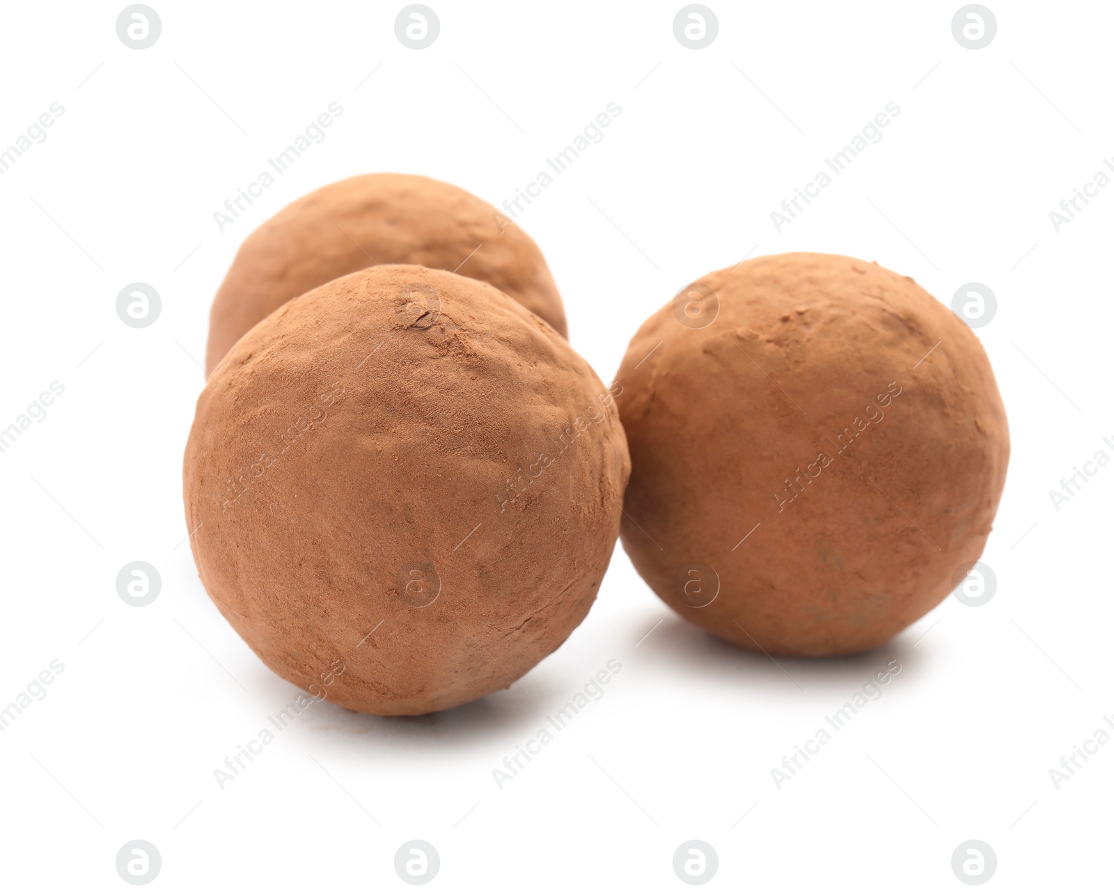 Photo of Delicious raw chocolate truffles on white background