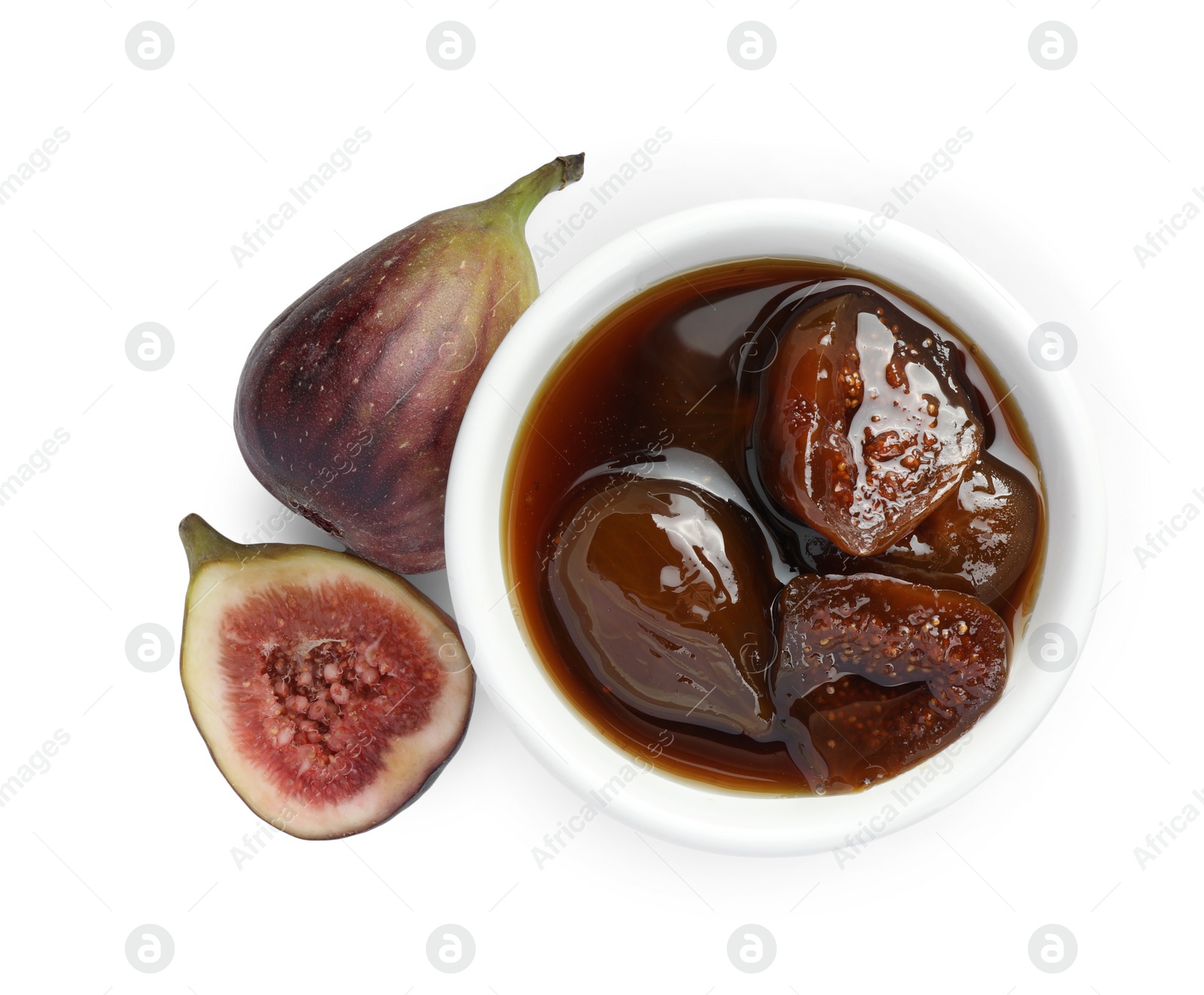 Photo of Bowl of tasty sweet jam and fresh figs isolated on white, top view