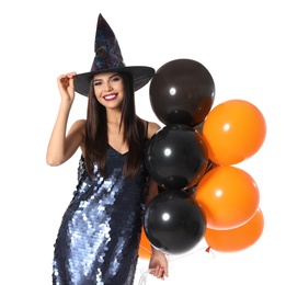 Photo of Beautiful woman wearing witch costume with balloons for Halloween party on white background