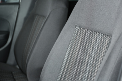 Photo of Car seat with grey upholstery, closeup view