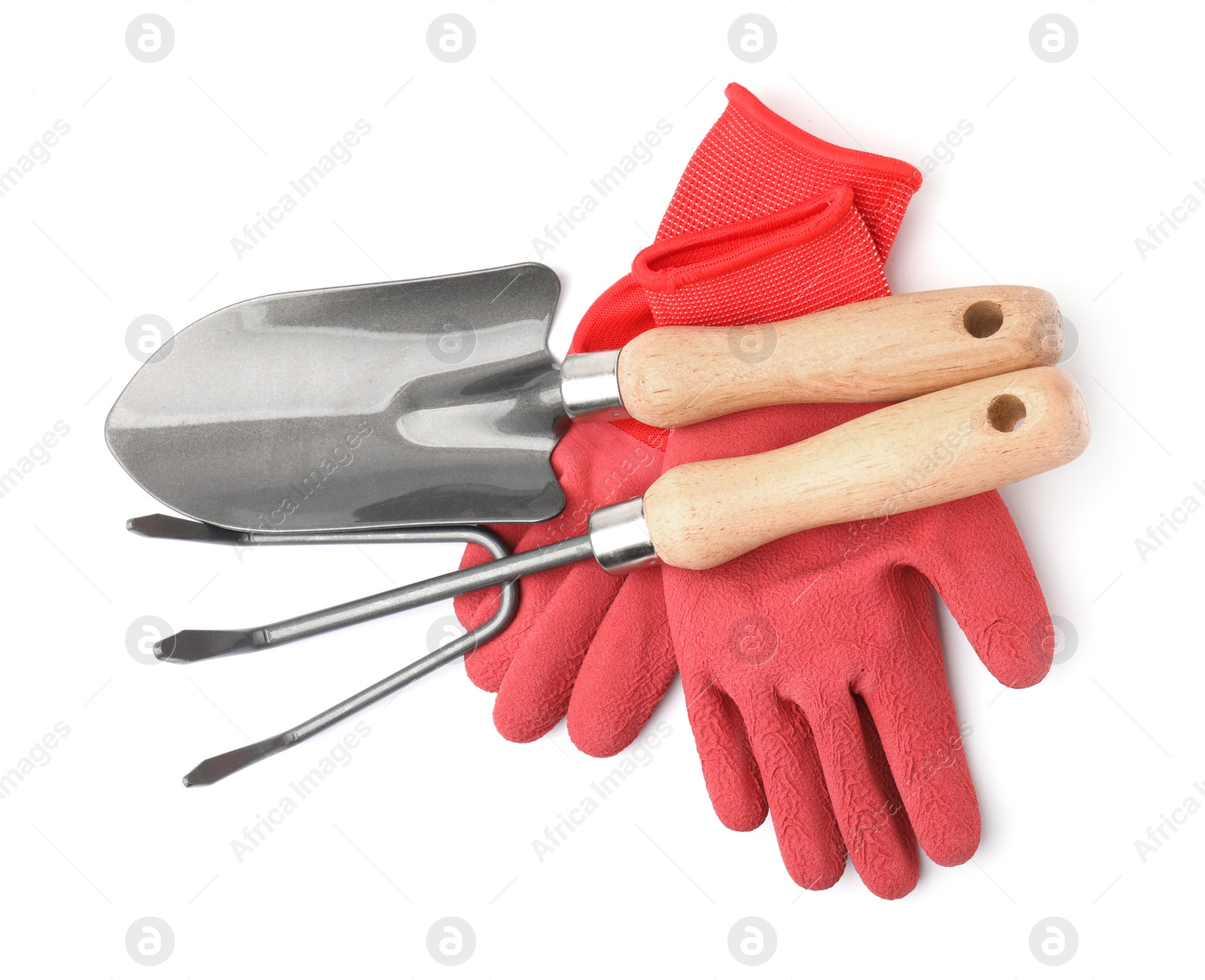 Photo of Gardening gloves, trowel and rake isolated on white, top view