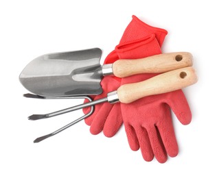 Photo of Gardening gloves, trowel and rake isolated on white, top view