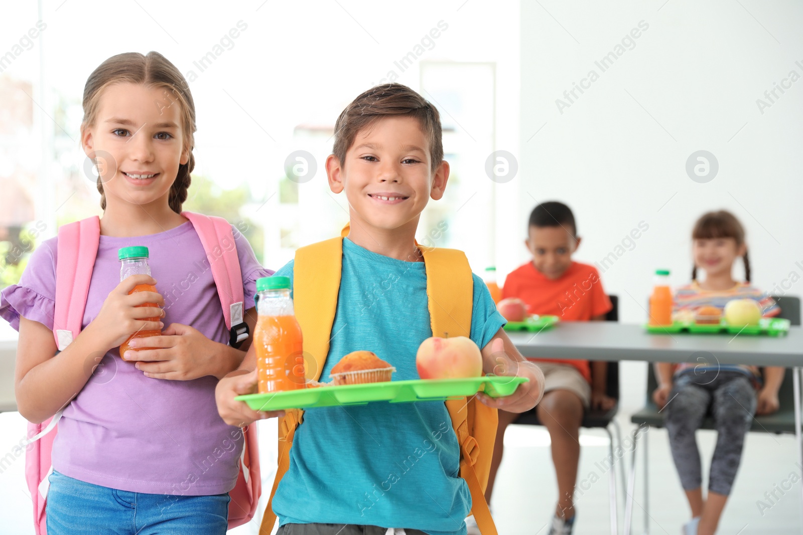 Photo of Children with healthy food at school canteen