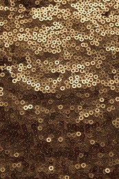 Photo of Beautiful golden sequin fabric as background, top view
