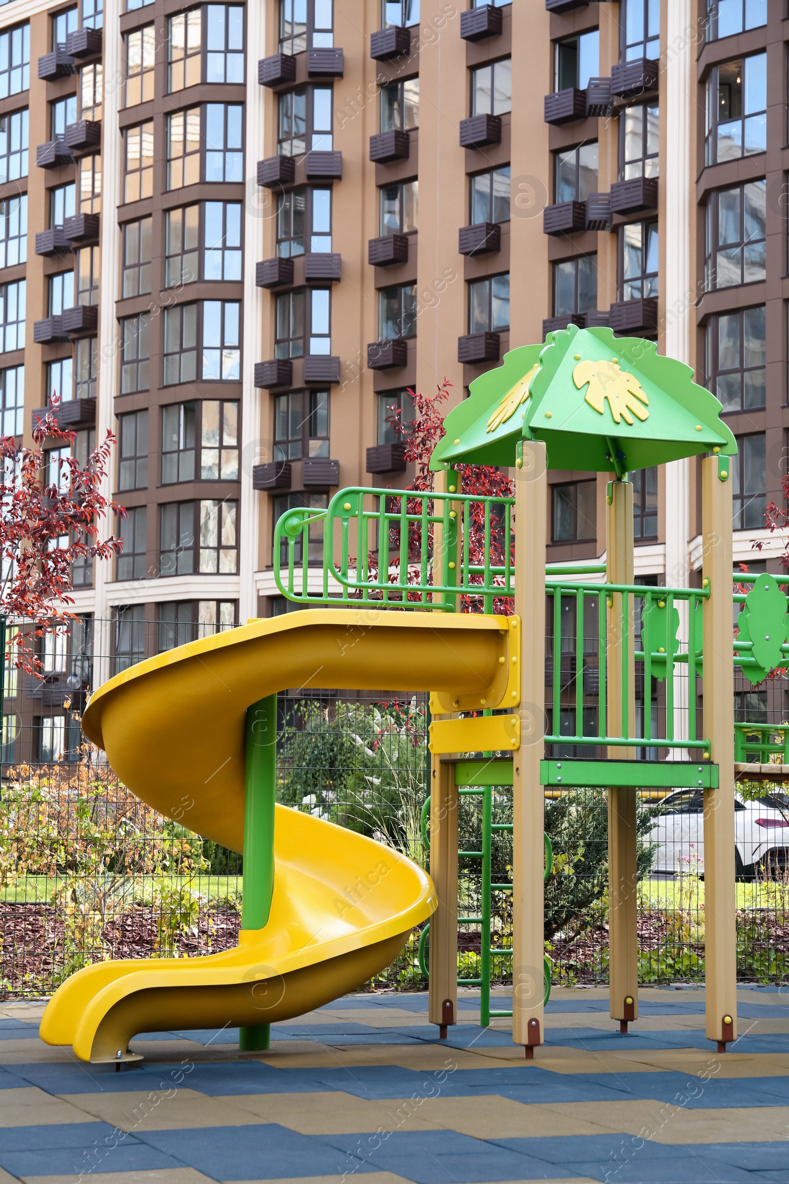 Photo of Colourful outdoor playground for children in residential area