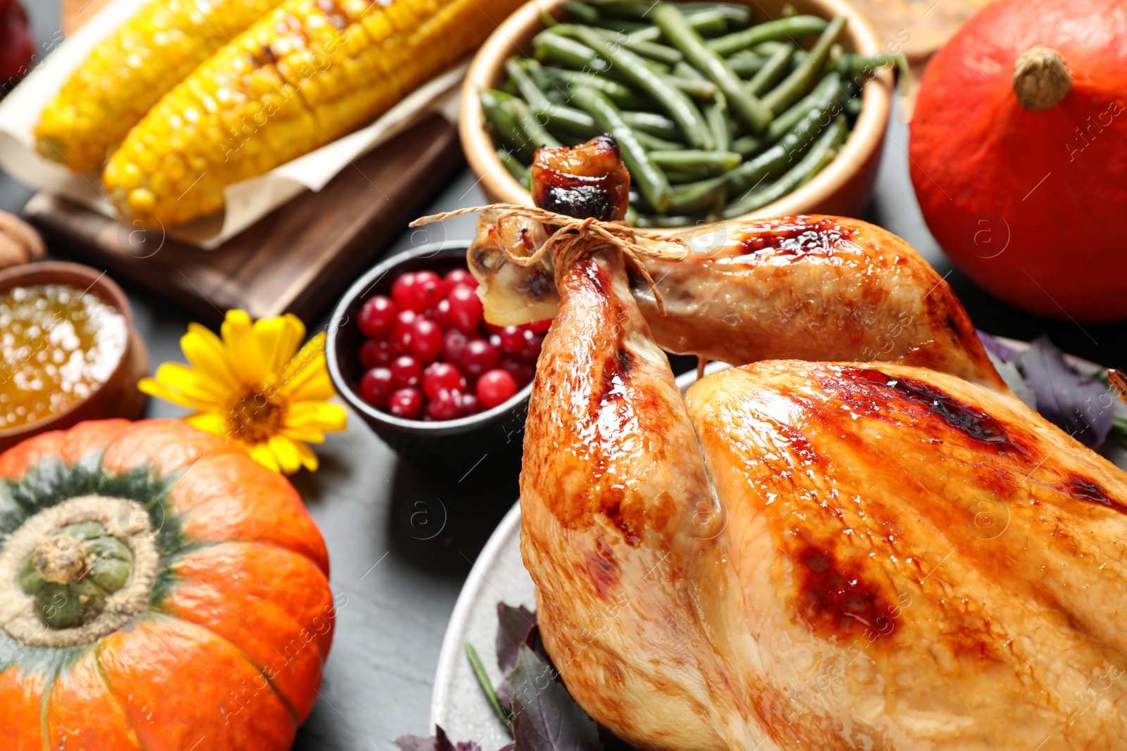 Photo of Composition with turkey on grey background, closeup. Happy Thanksgiving day