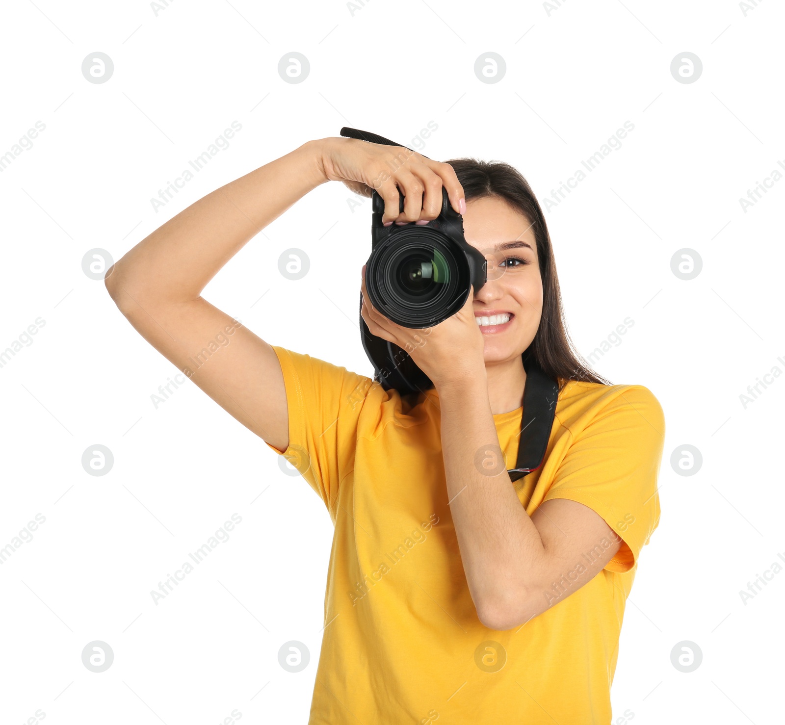 Photo of Young female photographer with camera on white background