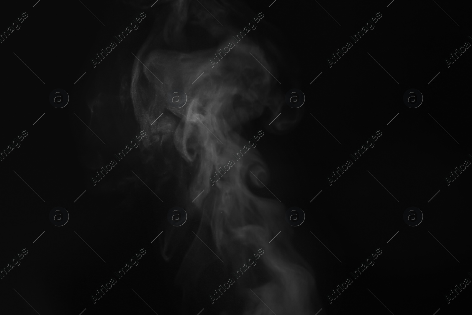 Photo of White steam in air against black background