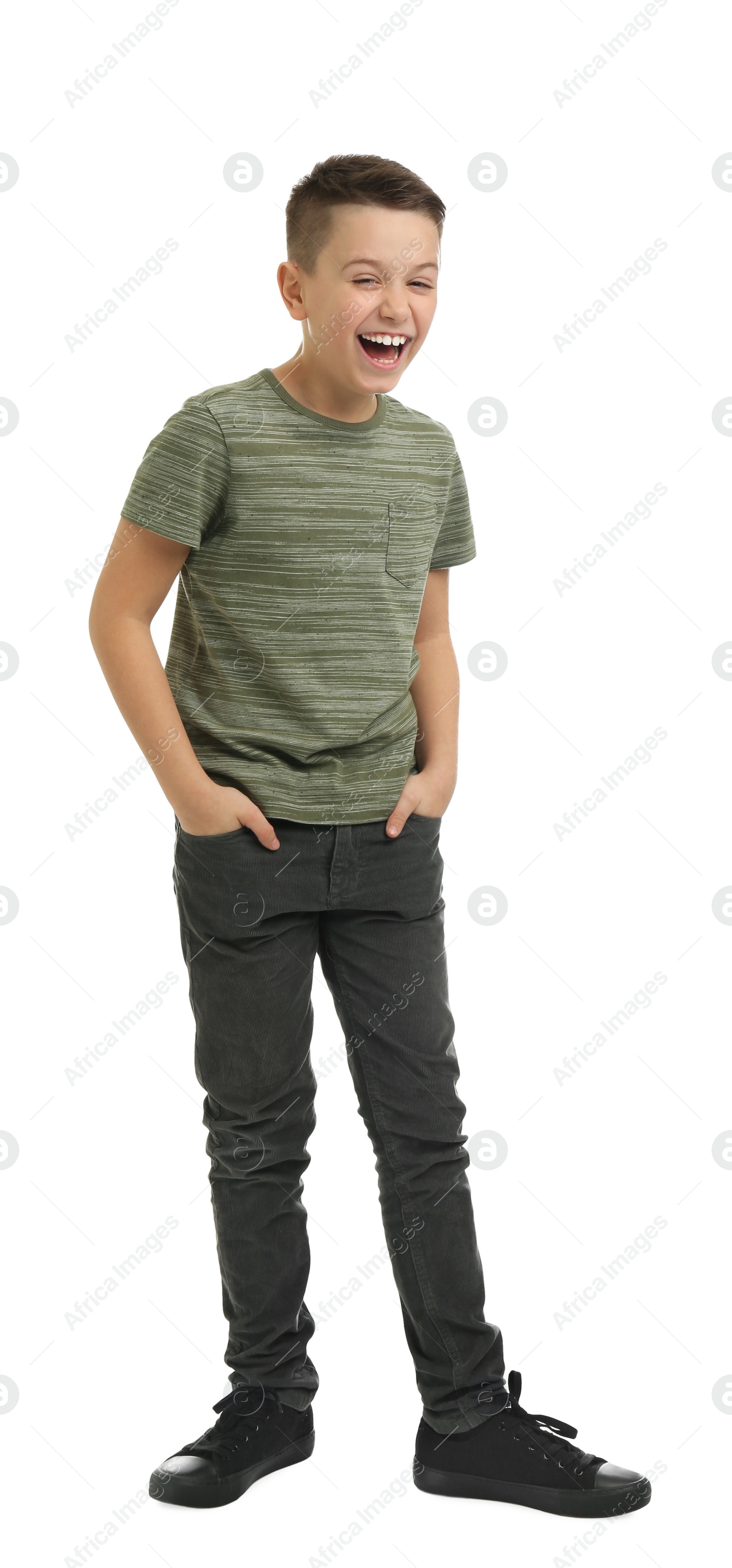 Photo of Full length portrait of laughing preteen boy on white background