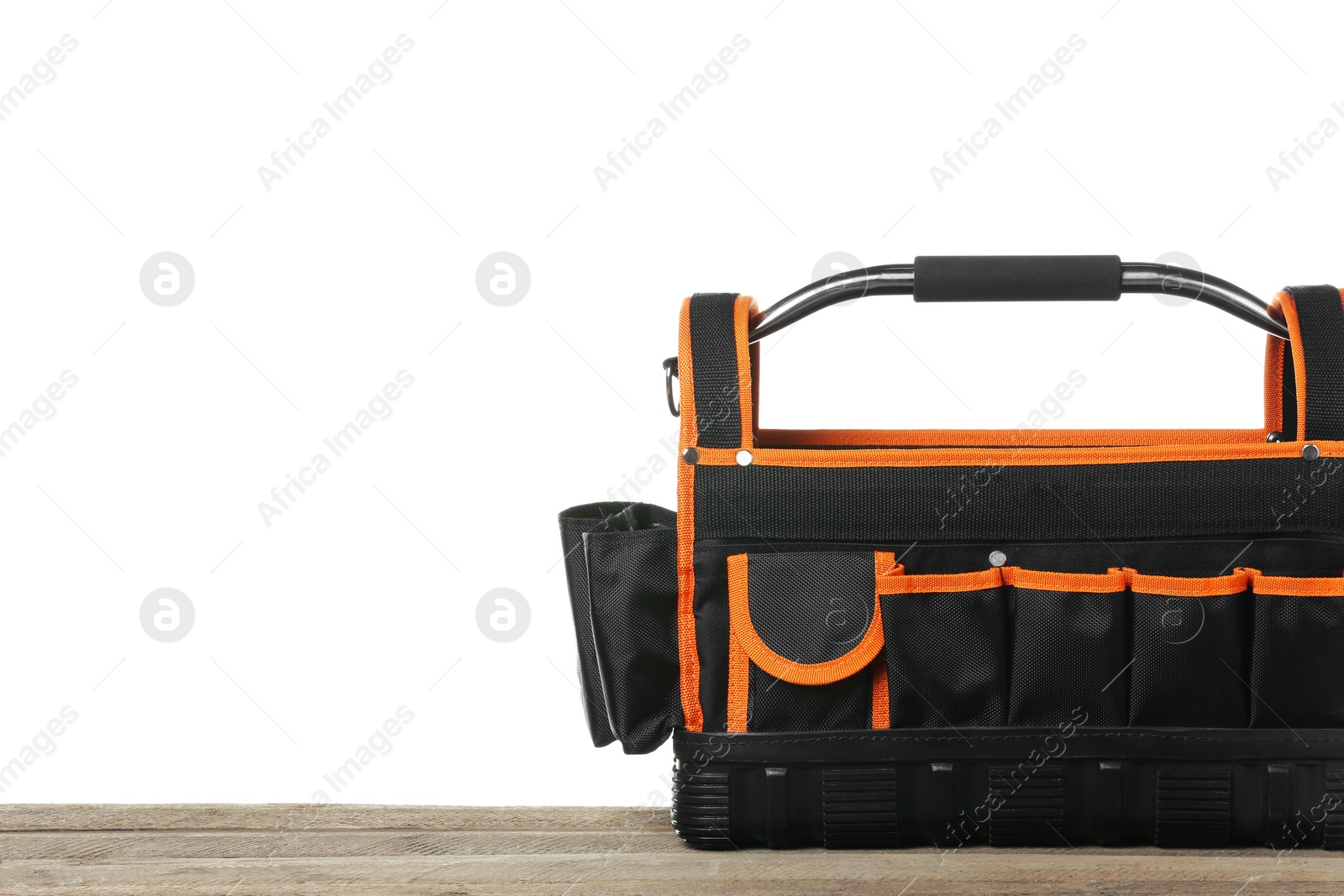 Photo of Empty bag for tools on wooden table against white background