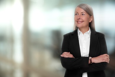 Lawyer, consultant, business owner. Confident woman smiling indoors, space for text