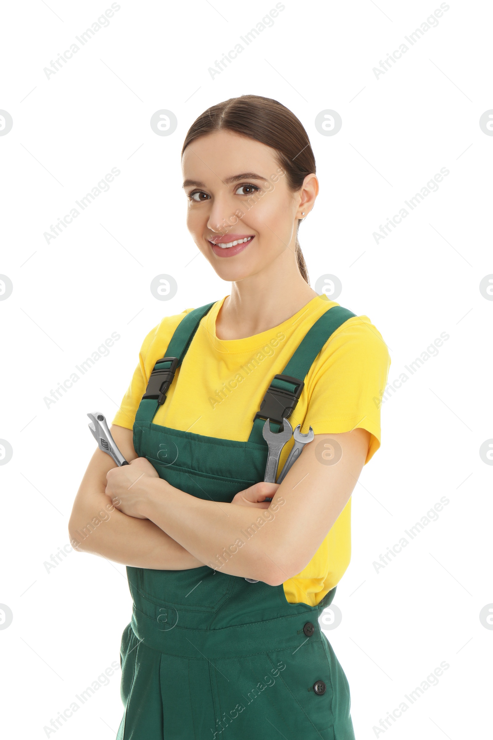 Photo of Portrait of professional auto mechanic with wrenches on white background