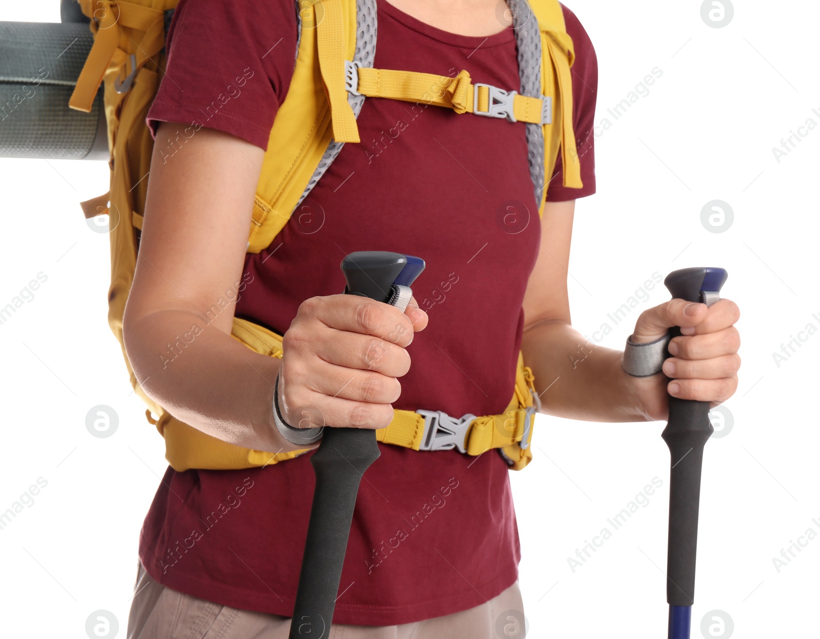 Photo of Female hiker with backpack and trekking poles on white background, closeup