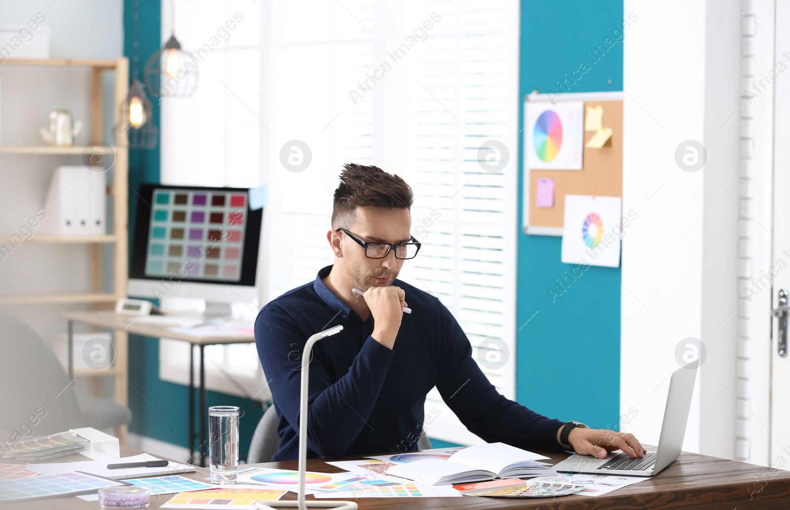 Photo of Professional interior designer at workplace in office