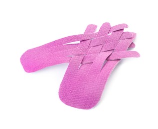 Photo of Violet kinesio tape pieces on white background