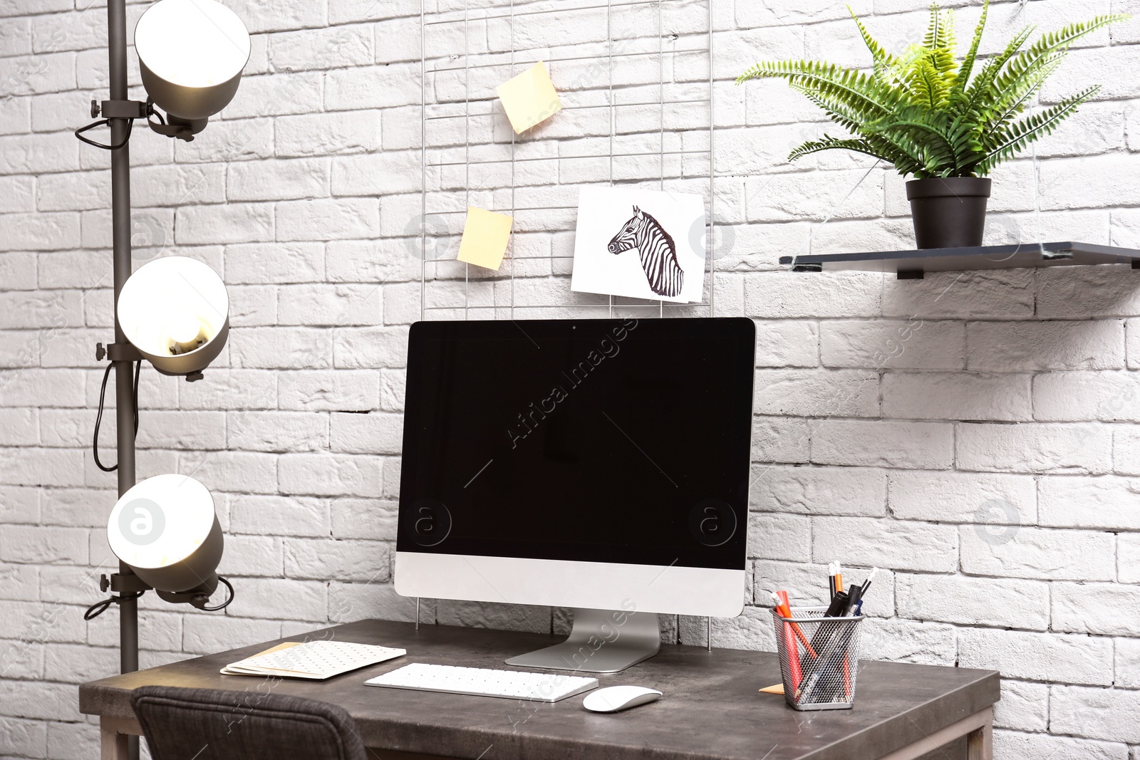 Photo of Comfortable workplace with computer on desk in home office