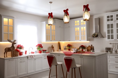 Photo of Stylish kitchen interior with beautiful Christmas decor