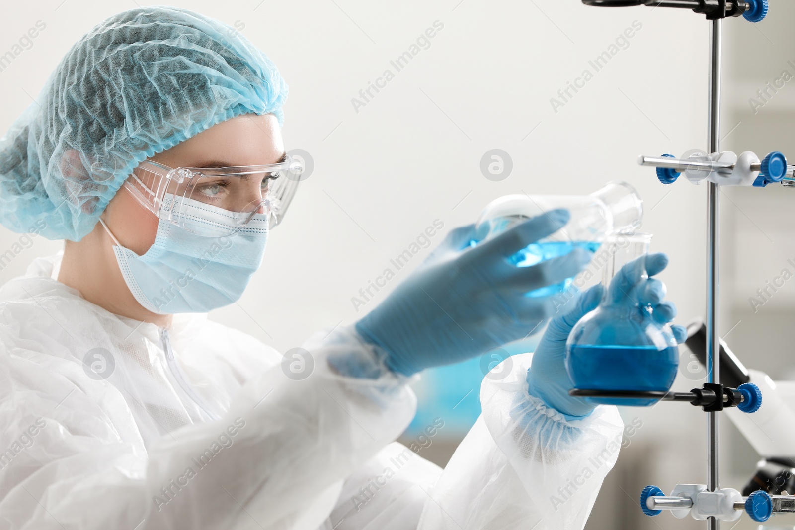 Photo of Young scientist working with samples in laboratory