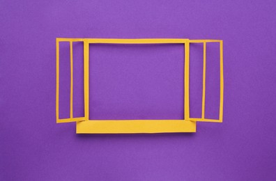 Photo of Open paper window frame on purple background. Space for text