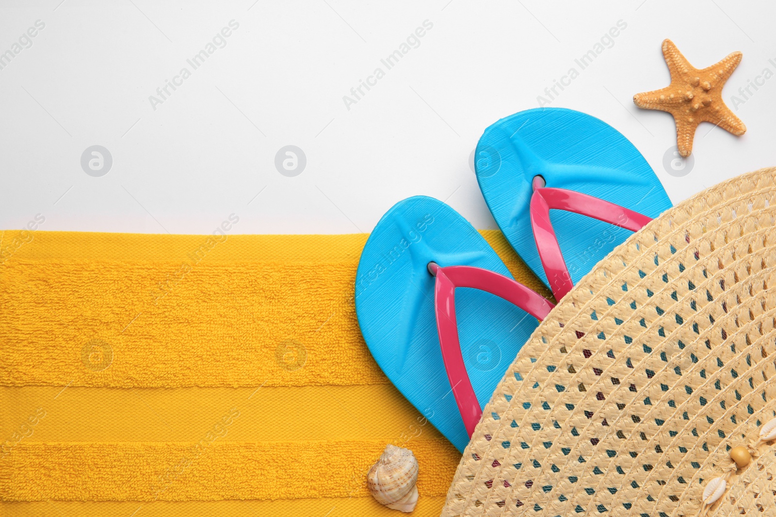 Photo of Flat lay composition with beach accessories on white background, space for text