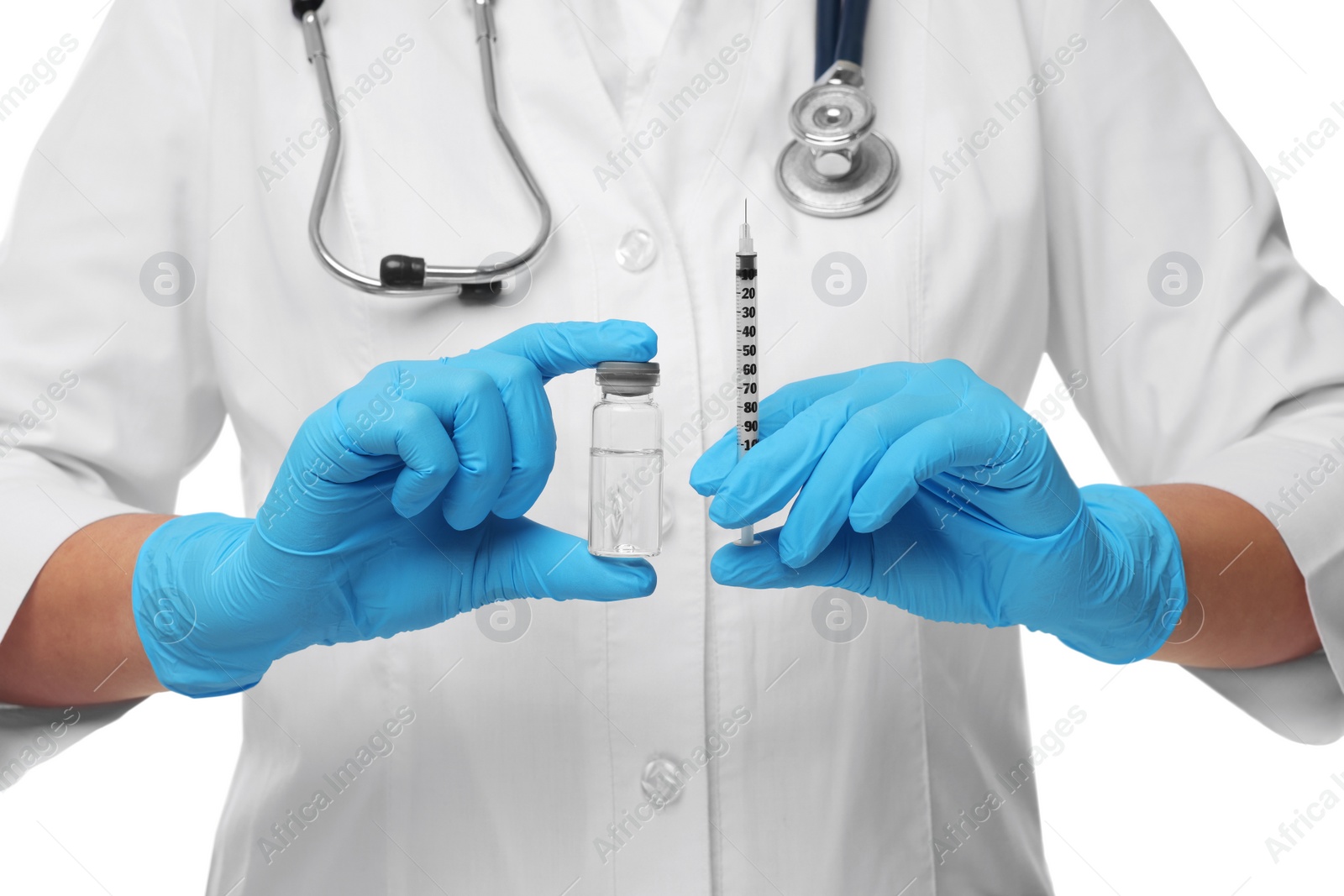 Photo of Doctor holding medical syringe and glass vial on white background, closeup