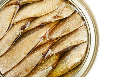 Photo of Sprats in tin can isolated on white, top view