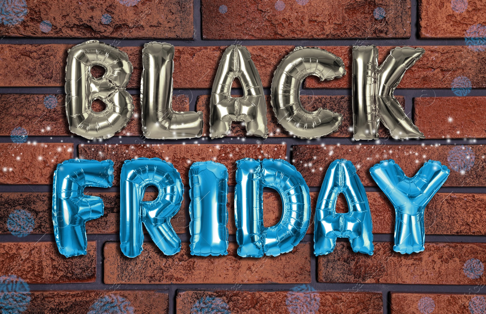 Image of Phrase BLACK FRIDAY made of foil balloon letters against brick wall