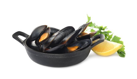 Pan of cooked mussels with parsley and lemon on white background