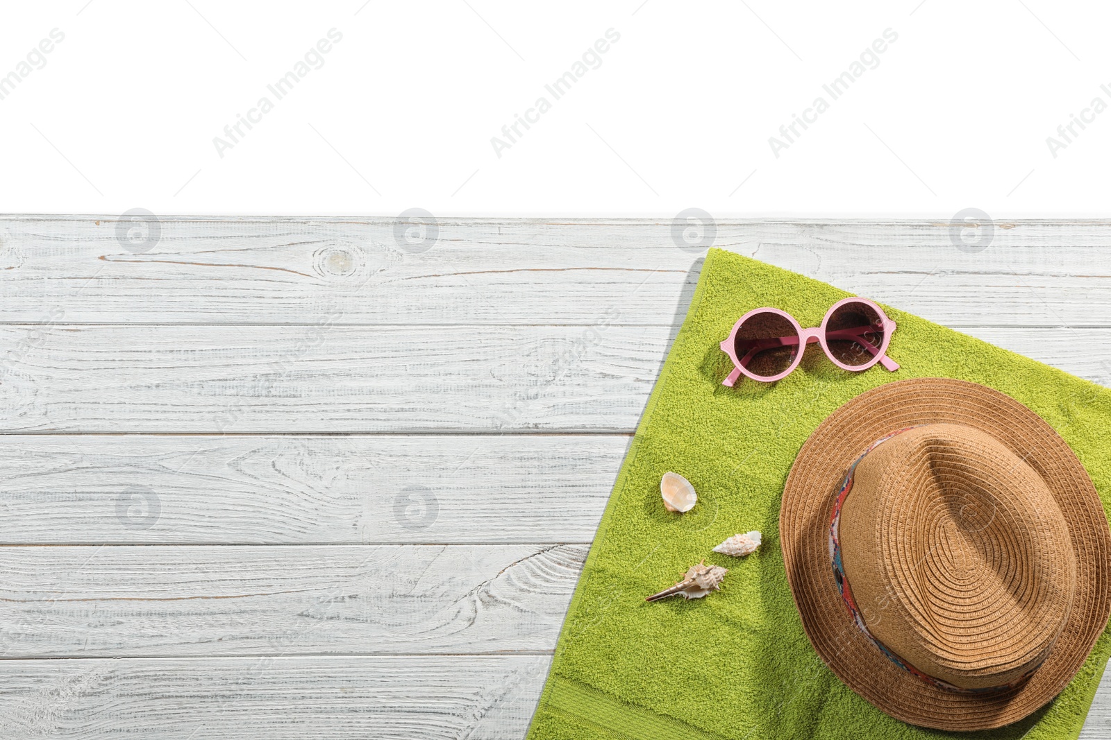 Photo of Flat lay composition with beach accessories on wooden background. Space for text