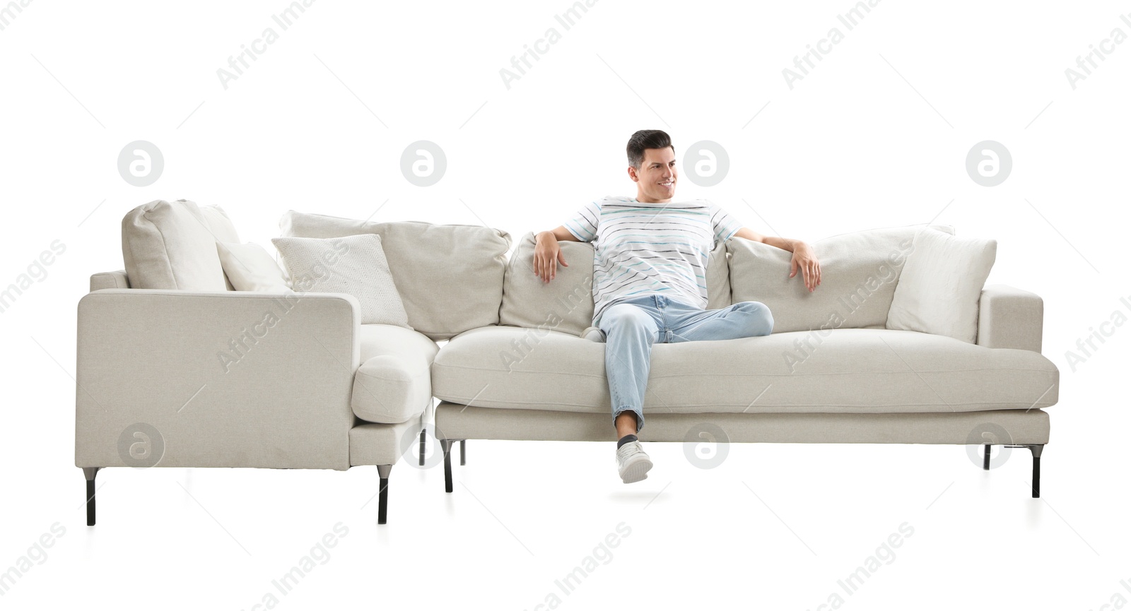 Photo of Man relaxing on comfortable sofa against white background