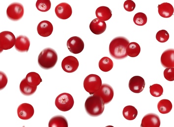 Image of Fresh red cranberries falling on white background