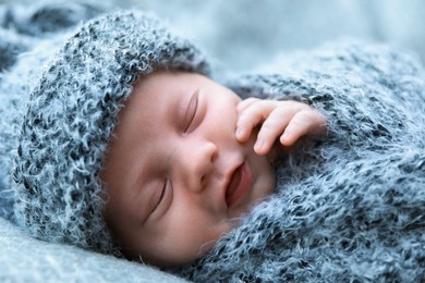 Photo of Cute newborn baby sleeping on blanket, closeup