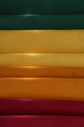 Photo of Different colorful napkins as background, top view