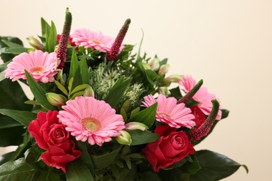 Photo of Bouquet of beautiful flowers on light background, closeup. Space for text