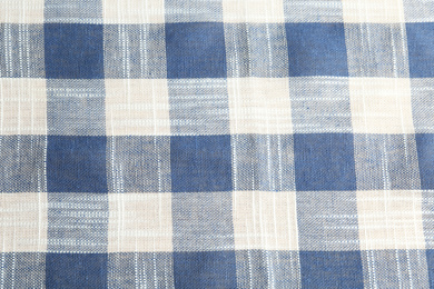 Photo of Texture of blue checkered fabric as background, closeup