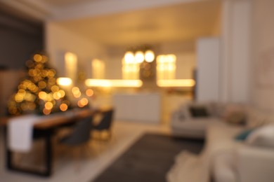 Photo of Blurred view of cozy kitchen decorated for Christmas. Interior design