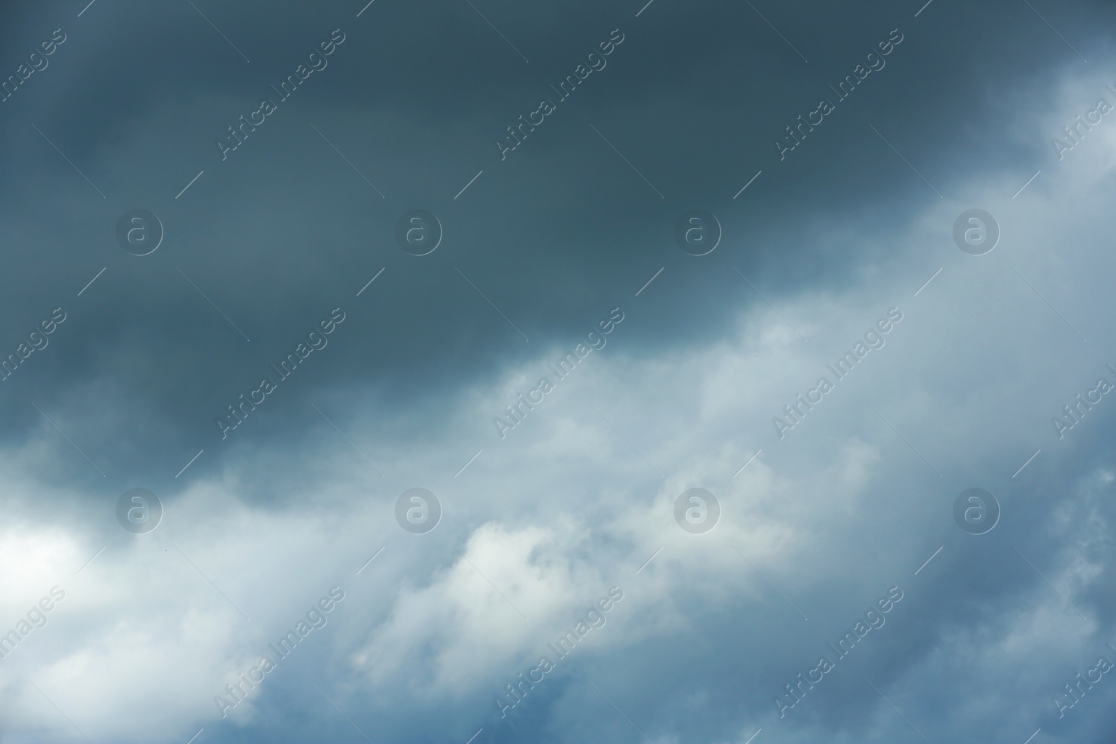 Photo of Sky with heavy rainy clouds on grey day