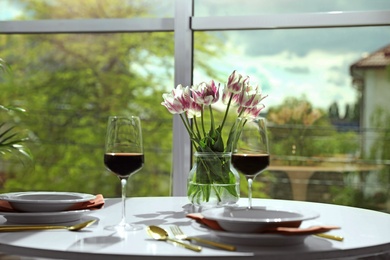 Photo of Glasses of wine on table in restaurant