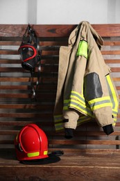 Firefighter`s uniform, helmet and mask at station