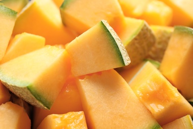 Pieces of tasty ripe melon as background, closeup