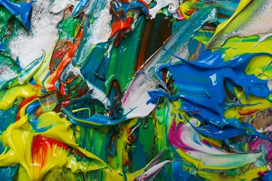 Photo of Abstract colorful acrylic paint as background, top view