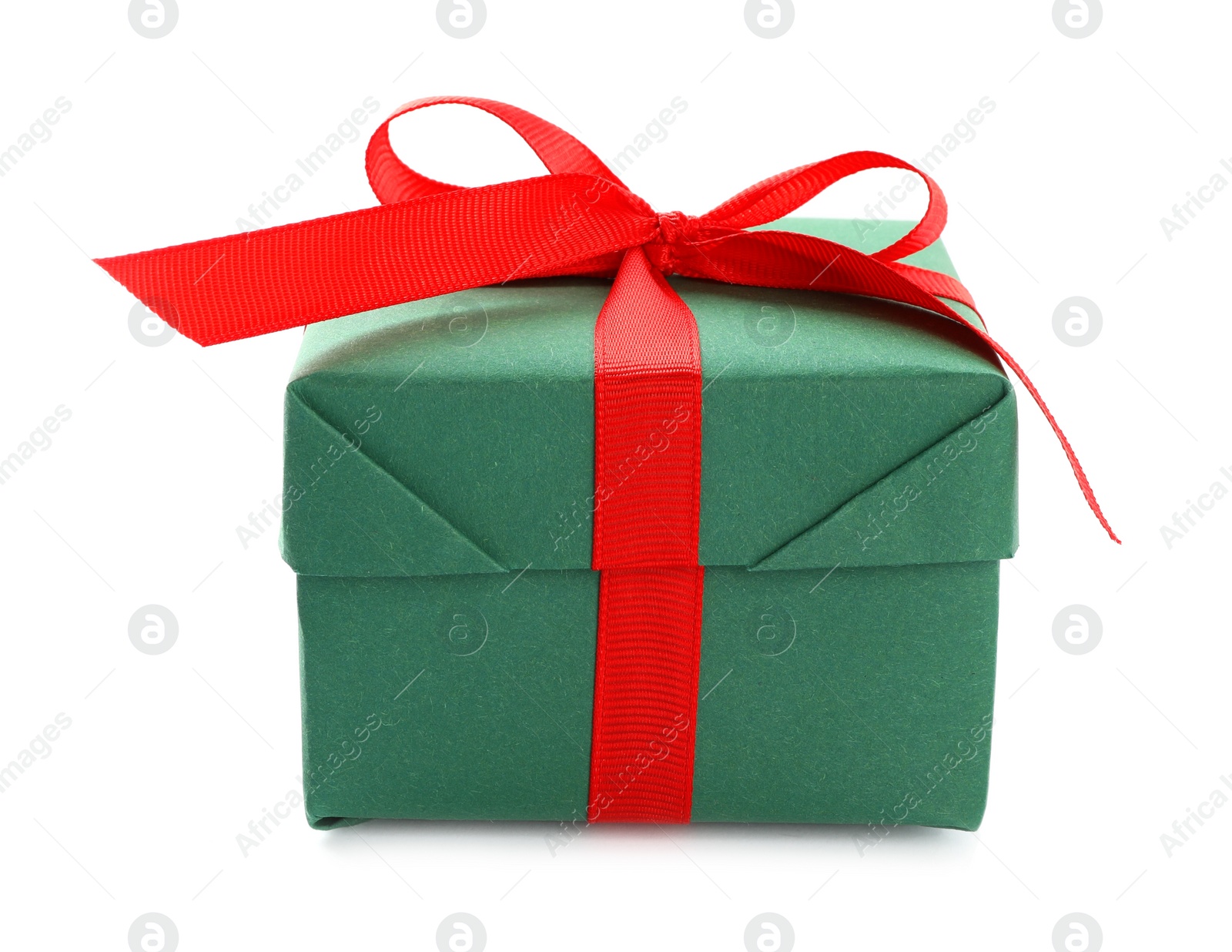 Photo of Christmas gift box decorated with red bow isolated on white