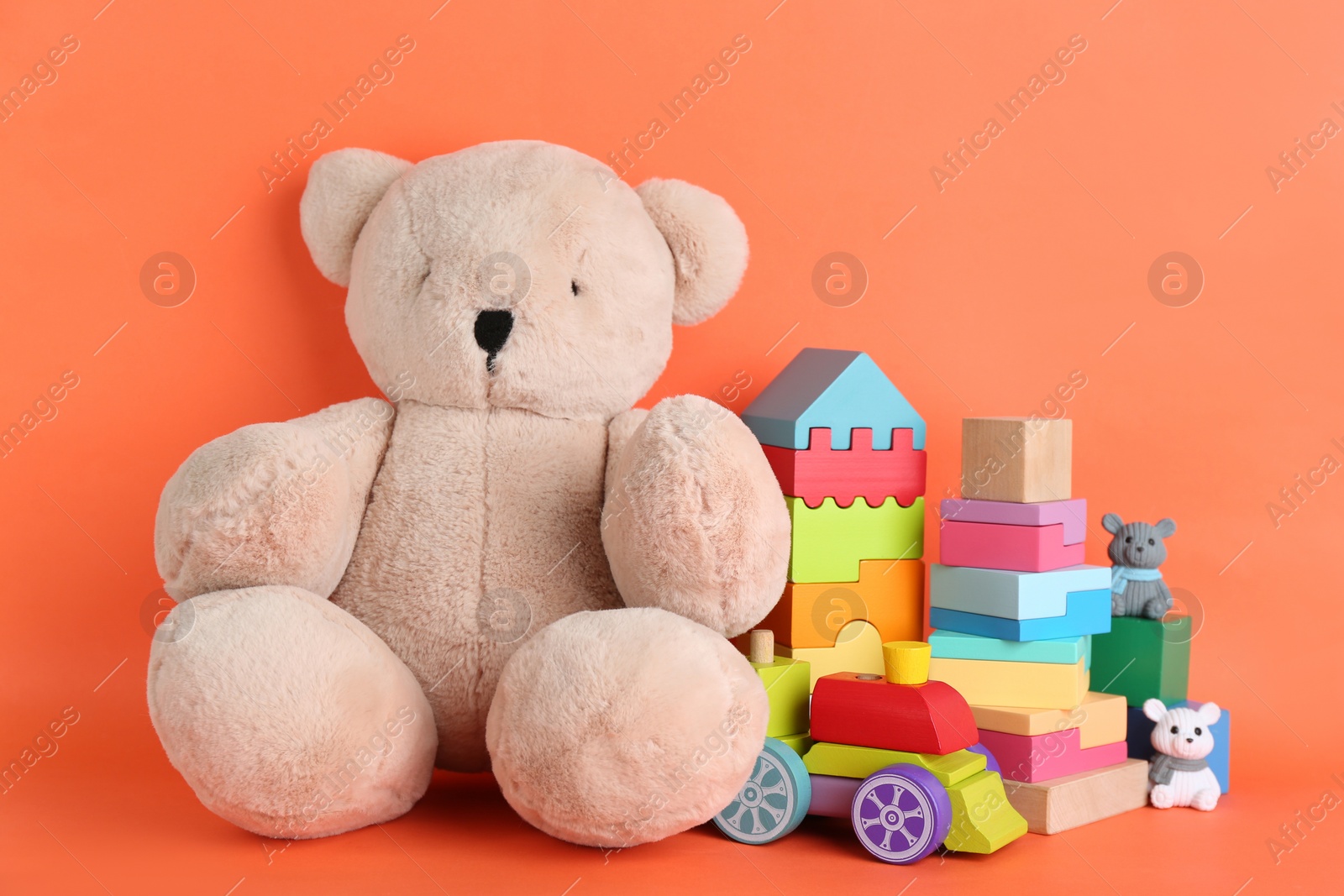 Photo of Set of different toys on orange background